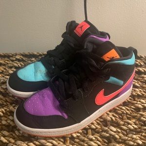 Kids multi colored Jordan 1 mids.